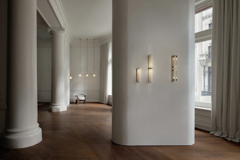 Articolo Studios luxury lighting. Slim end to end wall sconce. slim wall sconce. Loop wall sconce in snow bronze. Tubi wall sconce in snow brass and tubi pendant in snow brass