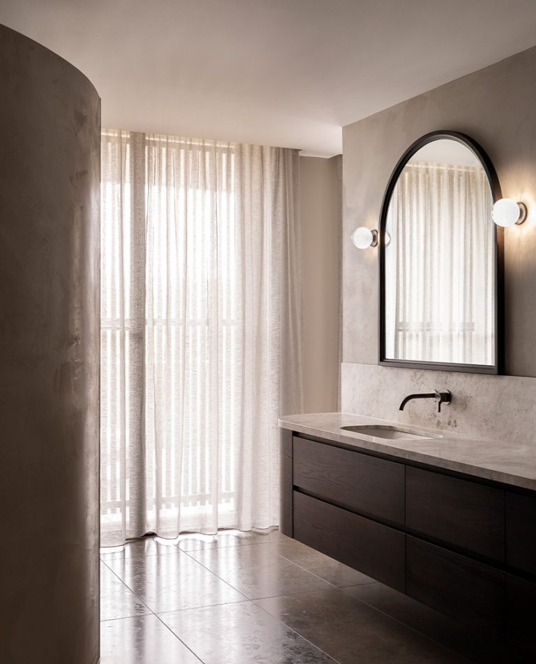 Articolo Studios Luxury Lighting Fizi Wall Sconce on Round in Bathroom of Lynch Residence by Casa 62