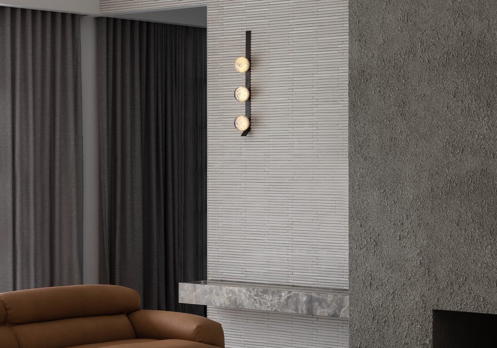 Articolo Studios Luxury Lighting Fizi Triple Wall Sconce on Kick in Living room of peninsula farmhouse