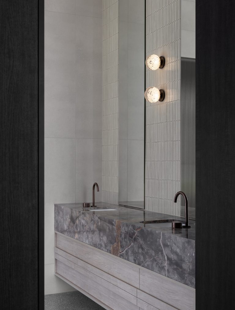 Articolo Studios Luxury Lighting Fizi on Round Wall Sconce in Bathroom of Peninsula Farmhouse